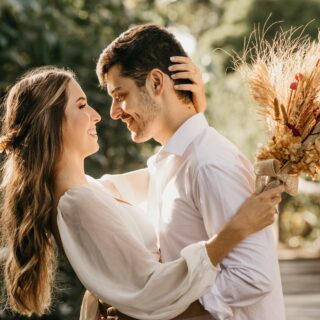 bride and groom embracing outdoors