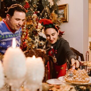 delighted diverse spouses celebrating christmas at home