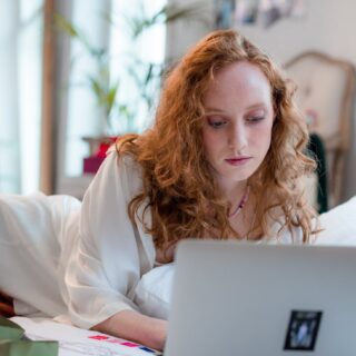 a woman using her laptop