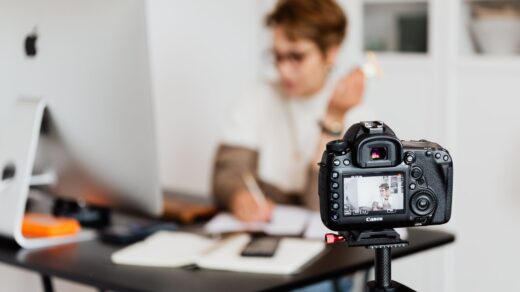 professional photo camera taking photos of anonymous businesswoman