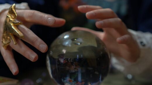 hands over fortune telling crystal ball