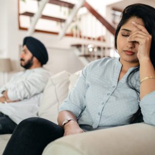 upset young indian couple after conflict