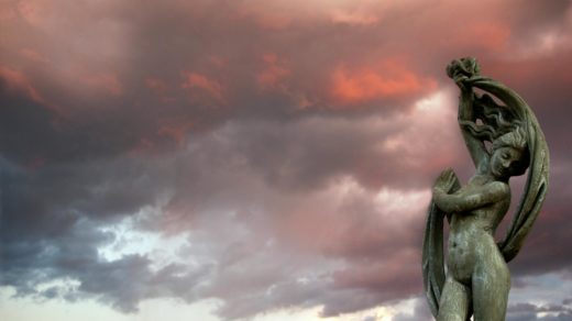 woman statuette during golden hour