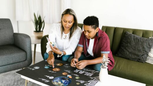 a woman and boy doing school project
