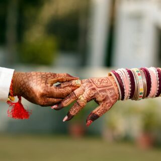 traditional indian wedding henna hands holding