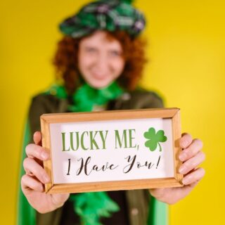 a woman holding a framed message
