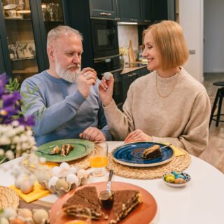 elderly couple having a homemade dinner