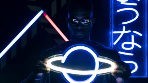 a man holding a neon lights