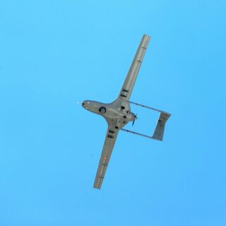 drone flying against a clear blue sky