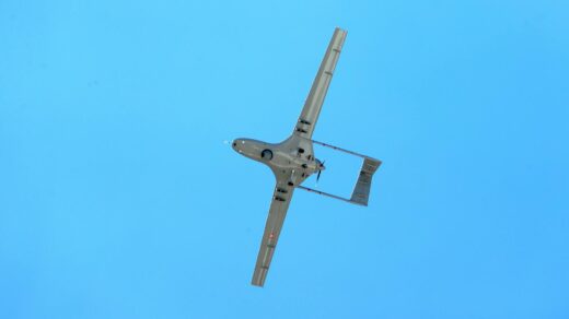 drone flying against a clear blue sky