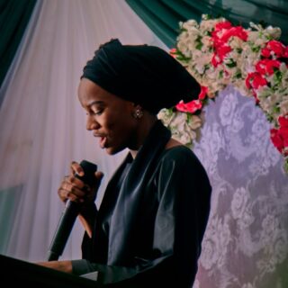 elegant woman delivering speech at event