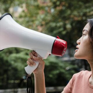 woman holding a megaphone