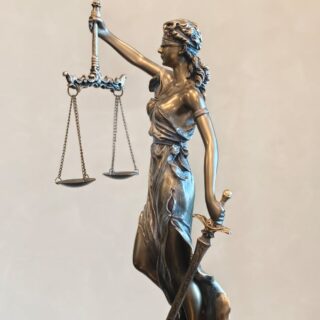 elegant bronze lady justice statue with sword