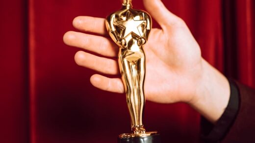 gold trophy on person s hand