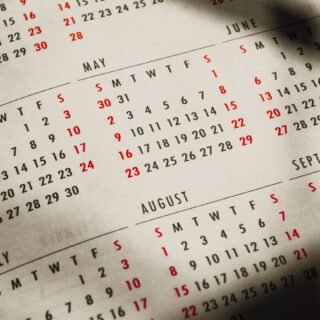 paper calendar with months and days in sunbeam