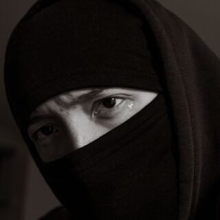teardrop from eyes of woman in niqab