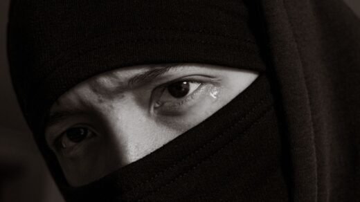 teardrop from eyes of woman in niqab